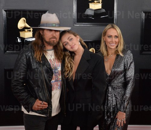 Billy Ray Cyrus, Miley Cyrus and Tish Cyrus arrive for the 61st Grammy Awards in Los Angeles