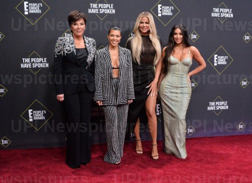 Kris Jenner, Kourtney Kardashian, Khloé Kardashian, and Kim Kardashian West attend E! People's Choice Awards in Santa Monica