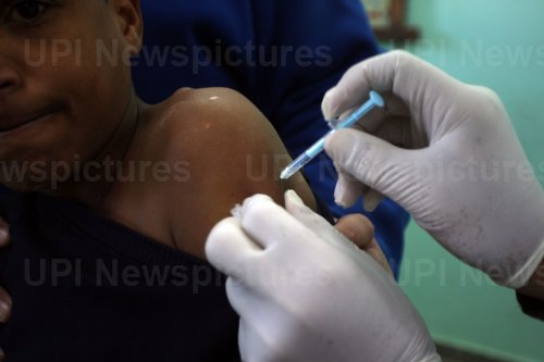 Health Workers Inoculate Students With a Dose of The Covid-19