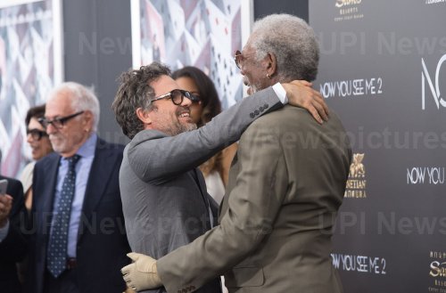 Mark Ruffalo and Morgan Freeman embrace as they arrive at the "Now You See Me 2" World Premiere