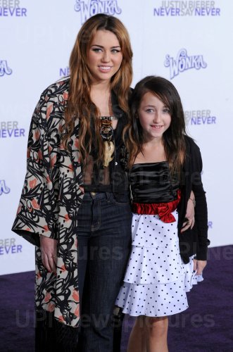Miley Cyrus and sister Noah attend the premiere of "Justin Bieber: Never Say Never" in Los Angeles